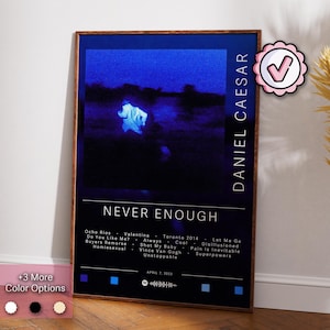May include: A framed poster with a dark blue background and the text "NEVER ENOUGH" in white. The poster features a blurred image of a person and a list of song titles. The artist's name, "DANIEL CAESAR," is printed vertically. Color options are shown.