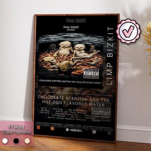 May include: A black and white album cover with a dark brown wood frame. The album cover features a band called Limp Bizkit. The album title is "Chocolate Starfish and the Hot Dog Flavored Water". The album cover features a band member with a starfish on their head and a hot dog in their mouth. The album cover also features a parental advisory sticker.