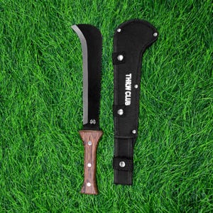 May include: A black machete with a curved blade and a wooden handle, alongside a black sheath. The machete has a serrated edge near the handle. The sheath is printed with the text "THRW CLUB".