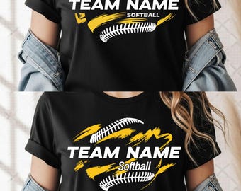 May include: Black t-shirt featuring a softball design with the words "TEAM NAME" and "Softball" in white. The design includes a yellow and white softball graphic. The shirt has short sleeves.