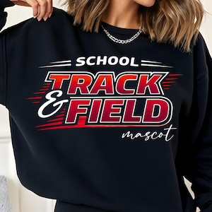 May include: Black sweatshirt with the words "SCHOOL TRACK & FIELD mascot" in red and white lettering. The design includes red speed lines and a white cursive font for "mascot".