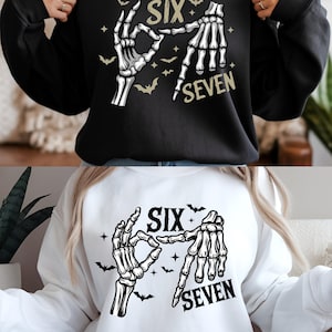 May include: Black and white sweatshirts with a skeleton hand design spelling out the numbers "six" and "seven". The design includes bats and stars. One sweatshirt is black, the other is white.
