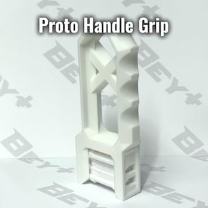 May include: A white Proto Handle Grip featuring a vertical, elongated structure with a scalloped edge for finger placement and a central X-shaped support. The base includes a rectangular attachment point with visible mechanical details.