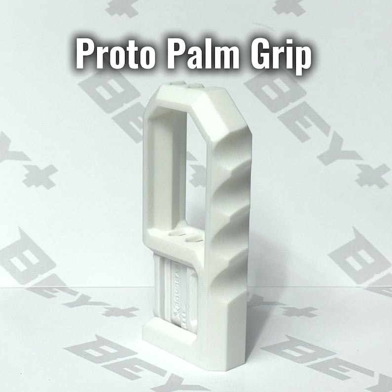May include: A white Proto Palm Grip tool featuring a vertical rectangular frame with a hollow center and a side edge designed with four distinct finger indentations for ergonomic handling, standing upright with a flat base and a textured grip area.