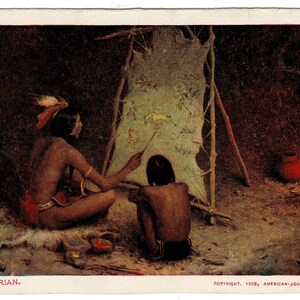 May include: Vintage postcard depicting two Native American figures in a cave-like setting. One figure points to drawings on a hide, while the other observes. A red pot and fire are visible. The text "THE HISTORIAN" is at the bottom.