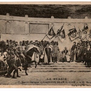 May include: Vintage black and white postcard depicting a large gathering of people, soldiers, and flags. A man on horseback is in the center. The text "LA SERBIE" is visible at the bottom, along with other text.
