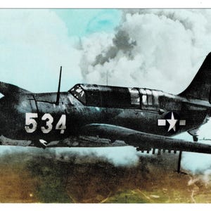 May include: Vintage black and white image of a military aircraft in flight. The plane, marked with the number 534, features a propeller and a star emblem on the wing. The background shows a cloudy sky and a landscape.