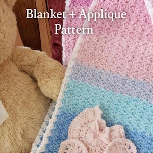 May include: A handmade crochet blanket in shades of pink, blue, and white, with a decorative carriage applique. The blanket has a textured stitch pattern and a white scalloped border. The text "Blanket + Applique Pattern" is visible.