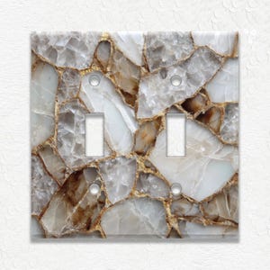 May include: A handmade wooden sign with the text "Welcome to our home" in a handwritten style. The sign is painted white with a distressed finish and a dark brown frame. It is designed for indoor or outdoor use.