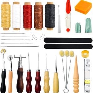 May include: A leathercrafting kit with various tools and supplies. Includes spools of yellow, white, red, brown, and black thread, needles, awls, a tracing wheel, a cutting tool, a measuring tape, and other accessories.