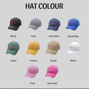 May include: A collection of baseball caps in various colors, including black, grey, navy blue, royal blue, green, yellow, khaki, white, pink, and rose red. Each cap has the word "Lover" embroidered on the front.