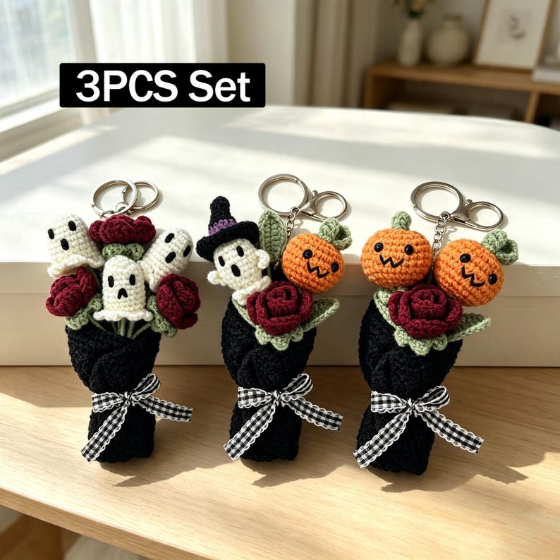 May include: A 3PCS Set of three crochet keychains featuring bouquets wrapped in black yarn with black and white gingham bows. The bouquets include dark red roses, white ghosts, orange pumpkins, and a ghost wearing a purple witch hat.