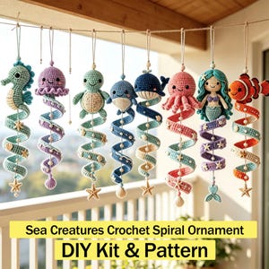 May include: Eight hanging crochet ornaments featuring sea creatures including a seahorse, jellyfish, turtle, whale, octopus, mermaid, and clownfish. Each figure is attached to a colorful spiral tail decorated with small beads and starfish accents.