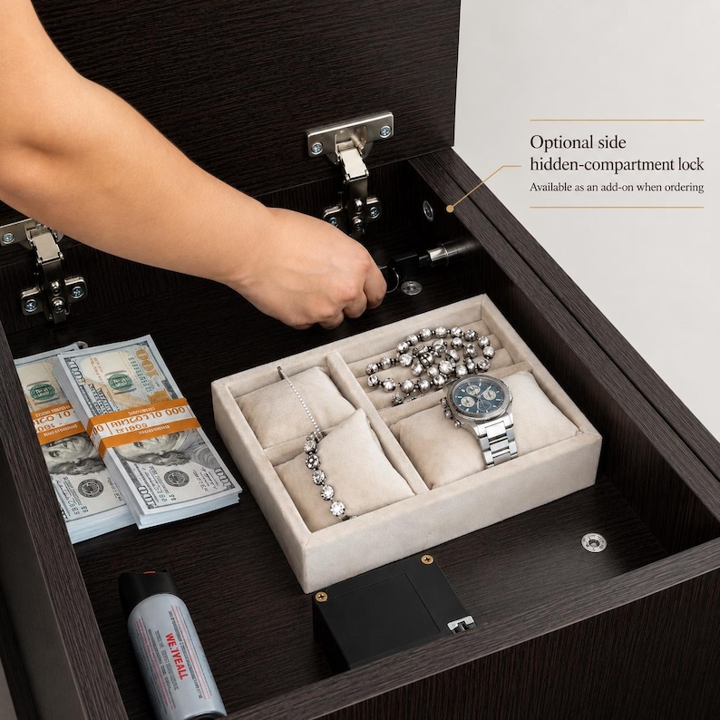 May include: A dark wood storage compartment featuring a beige velvet jewelry organizer tray containing a silver chain bracelet and a silver wristwatch. Stacks of one hundred dollar bills and a small canister are placed inside the open drawer.