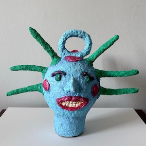 Paper mache sculpture “Just smile and shut up” monster head