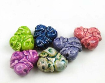 4 Tiny Skull Wheel Beads - mixed colors - CB782