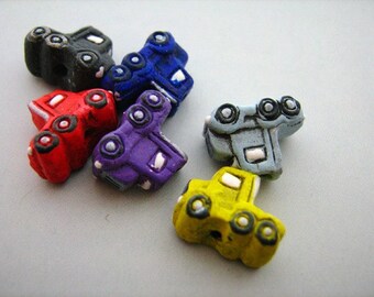4 Tiny Semi Truck Beads - mixed
