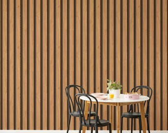 May include: A wall covered in vertical light brown wood slats with a natural grain pattern. In front of the wall stands a round white table with wooden legs, accompanied by three black chairs. A small plant and dishware sit on the table.