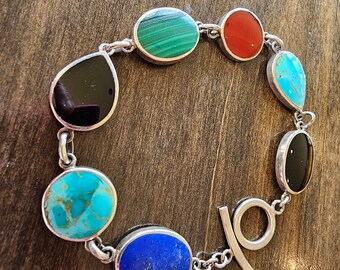 VINTAGE sterling silver bracelet with natural turquoise,malachite, carnelian, lapis lazuli, and black onyx, two-sided native design