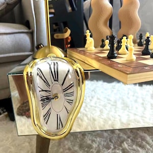 Horloge murale fondante inspirée de Salvador Dalí - Design goutte à goutte surréaliste en or, argent ou noir - Pièce maîtresse