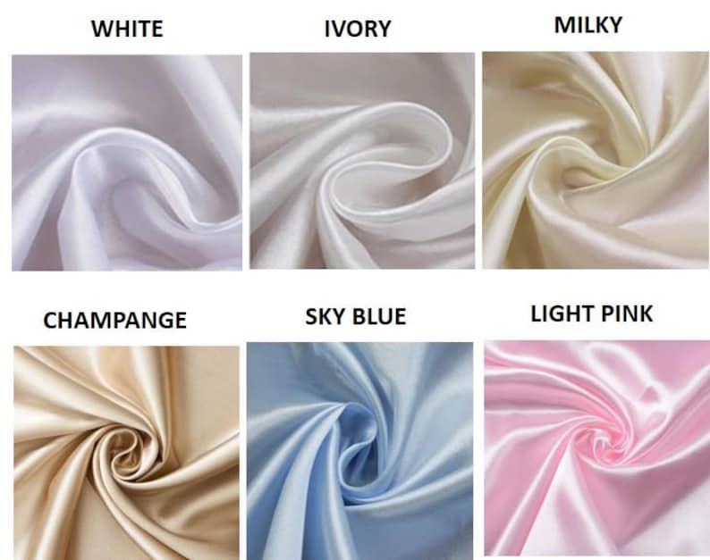 Op de afbeelding: Close-up van zes stoffen stalen in verschillende kleuren. De kleuren zijn wit, ivoor, melkachtig, champagne, hemelsblauw en lichtroze. De stof lijkt een gladde, glanzende satijn te zijn.