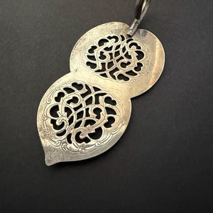 May include: A set of three ceramic mugs with a speckled, matte finish. The mugs are in shades of cream, light gray, and dark gray. Each mug has a simple, minimalist design, perfect for coffee or tea.