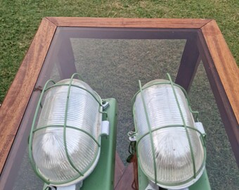 Pair of vintage green industrial lamps with prismatic glass and cage, loft-style factory wall sconces