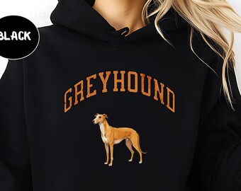 May include: Black hooded sweatshirt with the word "GREYHOUND" in orange arched lettering above a brown and white greyhound dog illustration. A black circle with the word "BLACK" is in the upper left corner.