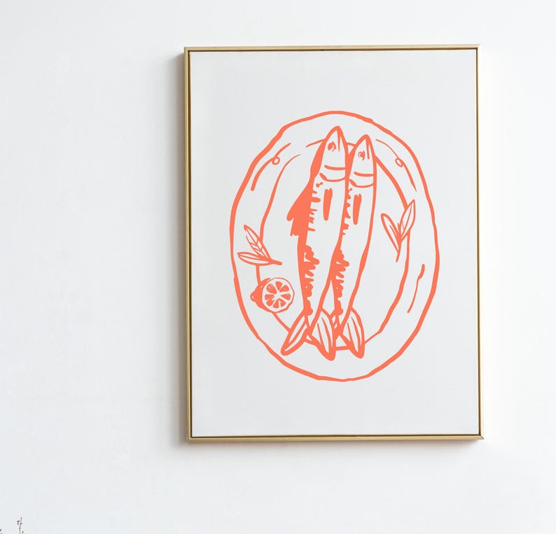 May include: A framed print of a stylized illustration of two fish on a plate with a lemon slice and leaves. The illustration is in a coral pink color.