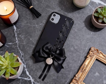 Niedliche Handytasche mit schwarzer Schleife