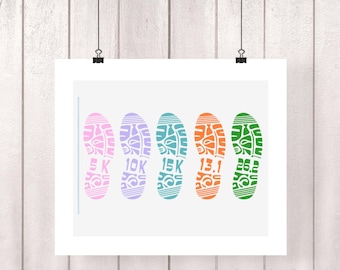 May include: A white rectangular print featuring five colorful shoe tread silhouettes arranged horizontally. The treads are pink, purple, teal, orange, and green, each containing the text 5K, 10K, 15K, 13.1, and 26.2 respectively, with a vertical line on the left.