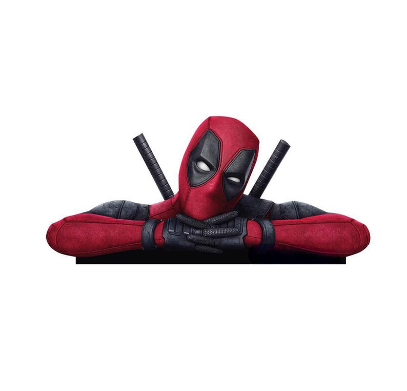 May include: A Deadpool character cutout featuring a red and black suit with a mask, white eye patches, and black gloves. The figure is shown from the chest up with arms crossed, resting on a flat edge, with two sword hilts visible behind the shoulders.