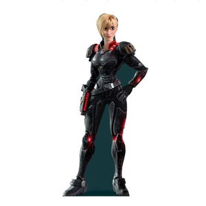 May include: A standing figurine of a character with short blonde hair, wearing a black tactical suit with shoulder armor, a utility belt, and dark boots. The suit features red glowing accents on the shoulders, arms, legs, and a weapon on the hip.