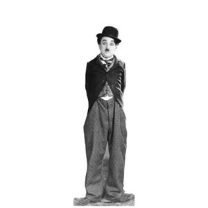 May include: Black and white image of Charlie Chaplin in his iconic attire. He wears a black bowler hat, a dark suit jacket over a vest, and oversized trousers. His hands are behind his back, and he has a small mustache.
