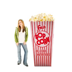 May include: A large popcorn container with red and white stripes, filled with popcorn. The container has the words "fresh POP CORN Delicious Nutritious" in red. A person is standing next to the container.