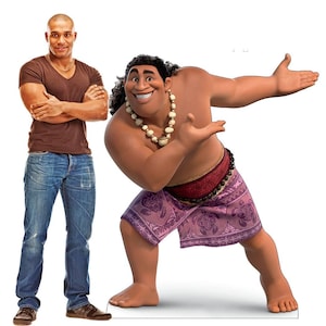 May include: A cartoon character wearing a purple and white patterned skirt and a red sash. The character is standing with one leg bent and the other leg straight. The character has brown skin, black hair, and a white necklace.