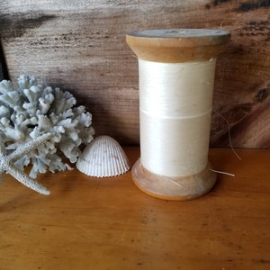Vintage Best-By-Test Wooden Spool with Bookbinding Thread Some thread remaining H.E. Locke and Co Lincoln