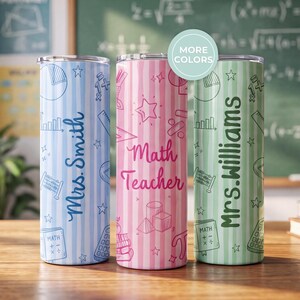 May include: Three cylindrical tumblers with striped patterns in light blue, pink, and light green. The blue tumbler features the text Mrs. Smith, the pink one says Math Teacher, and the green one displays Mrs. Williams, all with math-themed icons.