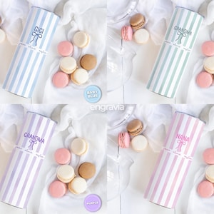 May include: Four cylindrical gift containers with vertical stripes in baby blue, mint, purple, and light pink. Each container has a name printed on it: Gigi, Grandma, and Nana. Macarons in various colors are arranged around the containers.