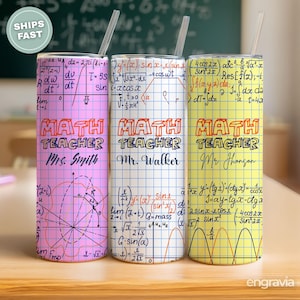May include: Three insulated tumblers with straws, each featuring a math theme. The tumblers are pink, white, and yellow, with equations and the words "MATH TEACHER" and a teacher's name. The tumblers are approximately 8 inches tall.