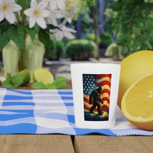 Patriotic Bigfoot American Flag 4th of July Shot Glass, Unique Barware, American Flag Design, Gift for Bigfoot Lovers, Collectible Shot Glas