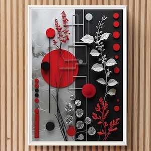 Op de afbeelding: Abstracte wandkunst in een witte lijst. Het kunstwerk heeft een gesplitst ontwerp met rode, zwarte en zilveren elementen. Rode cirkels en bloemmotieven contrasteren tegen een zwarte en zilveren achtergrond.