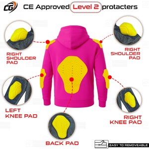 May include: A bright pink hoodie with yellow protective pads at the shoulders, elbows, back, and knees. The image shows the placement of the pads, labeled "CE Approved Level 2 protacters". The pads are easy to remove.