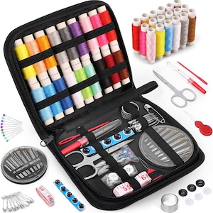 May include: A black zippered sewing kit, open to reveal spools of colorful thread, needles, scissors, buttons, pins, and a measuring tape. The kit includes a variety of sewing essentials for various projects.
