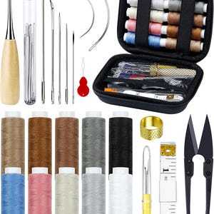 May include: A sewing kit with various tools and supplies. Includes spools of thread in multiple colors, needles, a thimble, scissors, a seam ripper, and a measuring tape. The kit is in a black zippered case.
