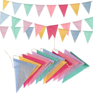May include: A collection of colorful triangle-shaped fabric bunting flags in shades of pink, yellow, blue, and green. The flags are strung together on twine, perfect for party decorations or festive displays.
