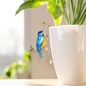 Dreamy bluebird plant stake – a mesmerizing blend of stained glass, crystals, and nature.