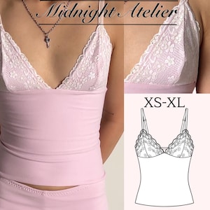 May include: A light pink camisole featuring a V-neckline with white floral lace trim and thin adjustable shoulder straps. The garment includes the text Midnight Atelier and a technical line drawing with the size range XS-XL displayed.