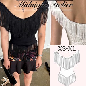 May include: A black off-the-shoulder top featuring long fringe detailing across the neckline and hem, with the text Midnight Atelier visible. A white version is shown from the back, and a line drawing includes the text XS-XL for sizing.