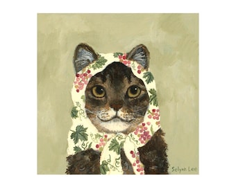 May include: A whimsical painting of a cat wearing a cream-colored headscarf adorned with red berries and green leaves. The cat has brown and black fur and is set against a muted green background. The artist's signature, "Selynn Lee," is visible.
